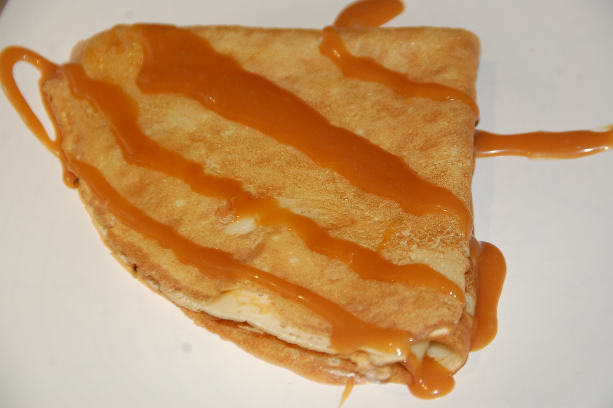 découvrez la délicieuse crêpe au caramel beurre salé, un dessert irrésistible alliant la douceur du caramel à la richesse du beurre salé. parfaite pour régaler vos papilles et apporter une touche gourmande à vos repas.